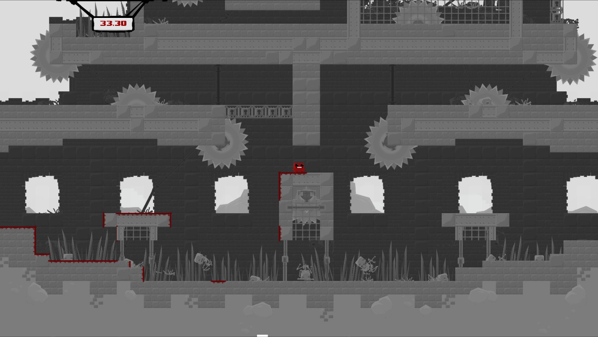 Screenshot ze Super Meat Boy: usmívající kus masa stojící v domě plném nebezpečných pilových kotoučů.